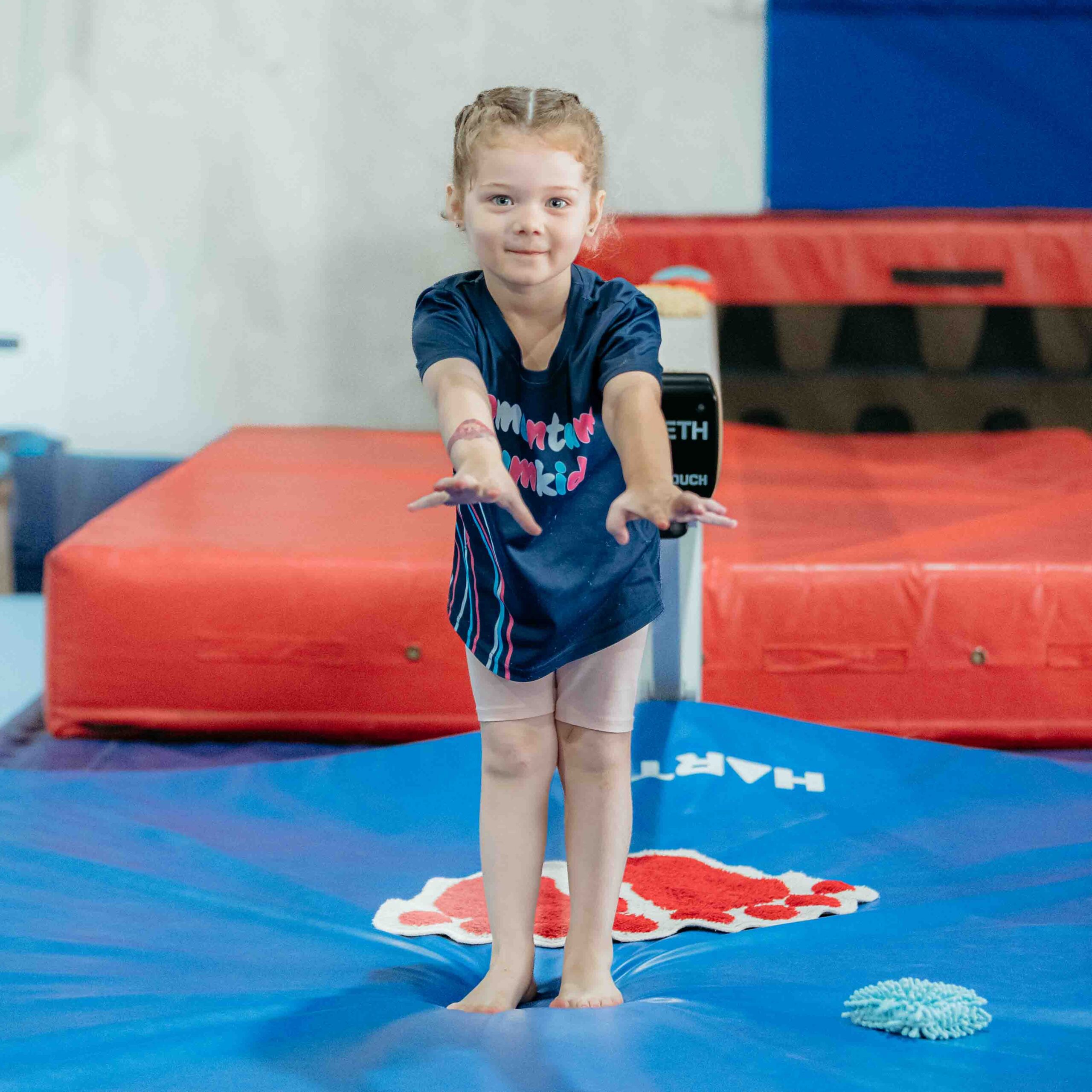 Kindy child gymnastics motorbike skill
